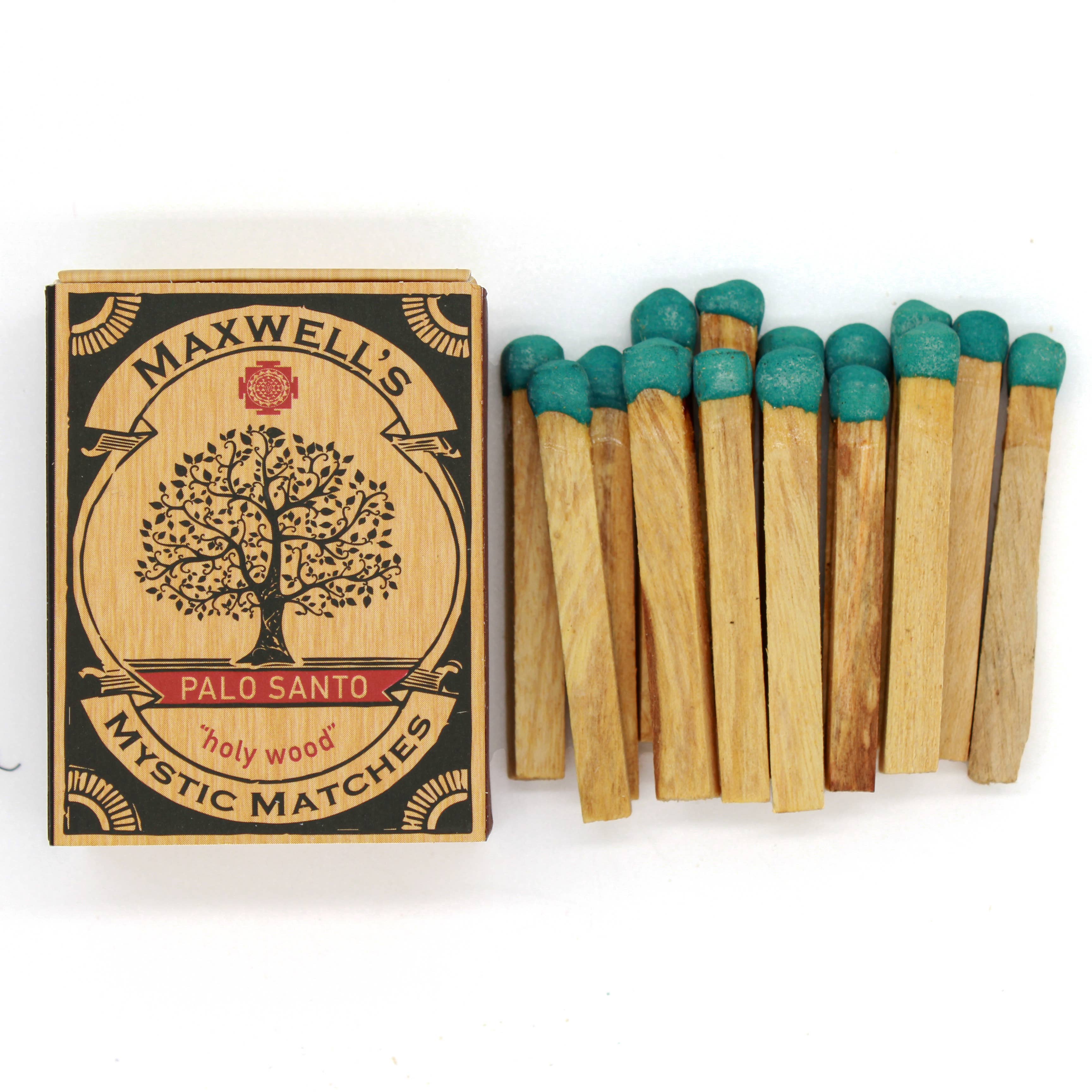 Maxwell's Palo Santo matches with wooden matches and green tops on a white background