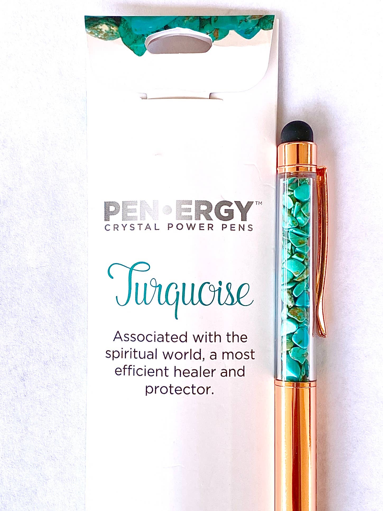 Pen of Energy Crystal Power Pen with turquoise design and packaging on a white background